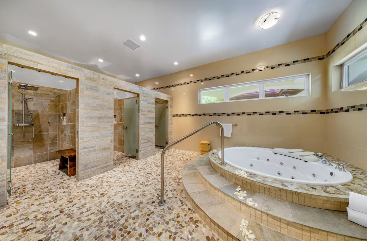 Spa room with walk-in showers and a whirlpool tub